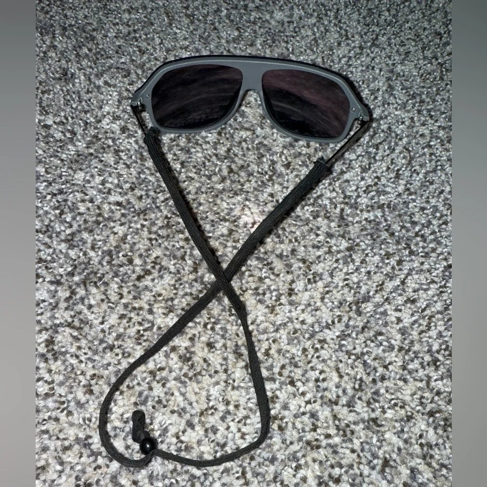 Red sunglasses with neck strap